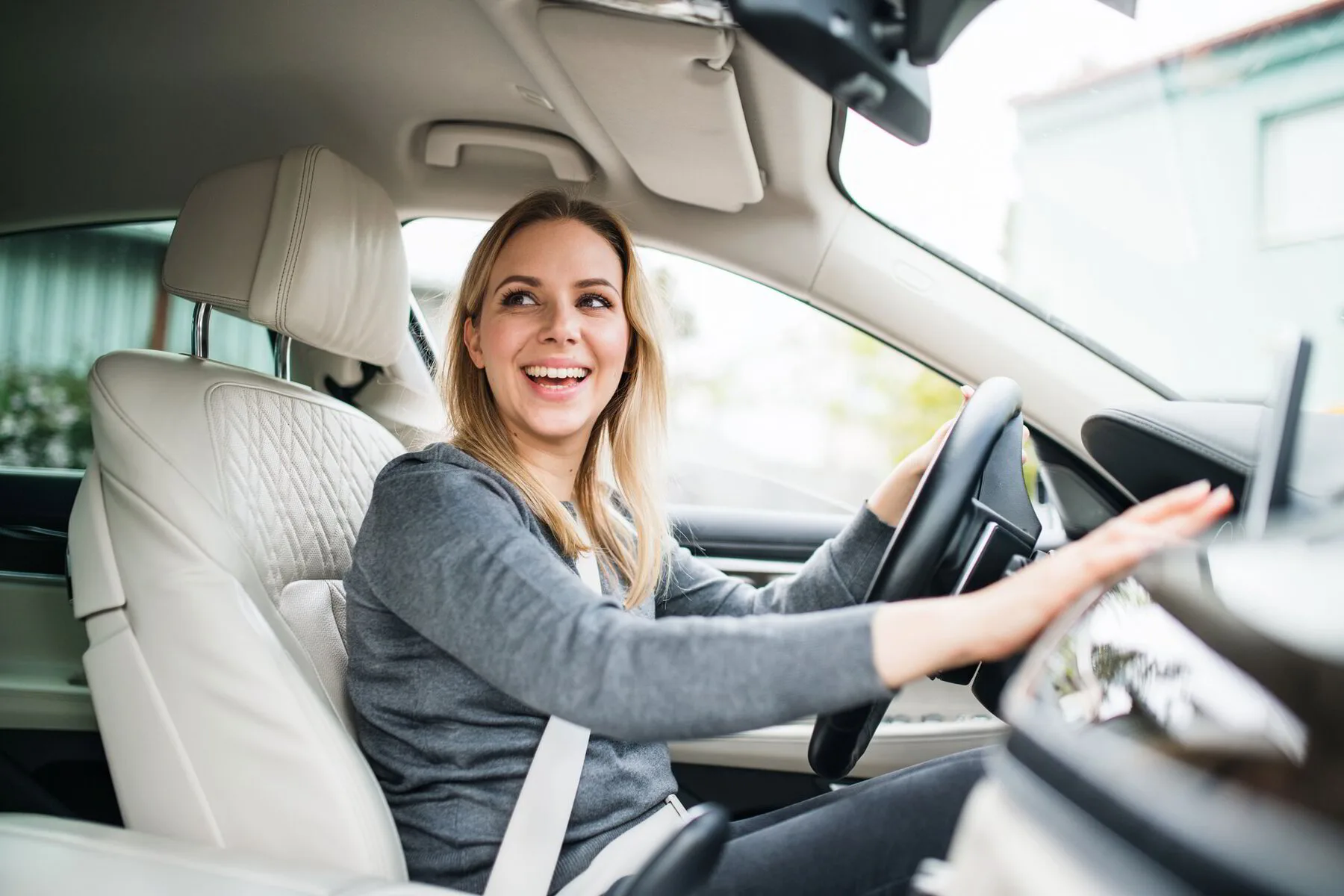 Happy Brittain's Express member smiling in their clean car